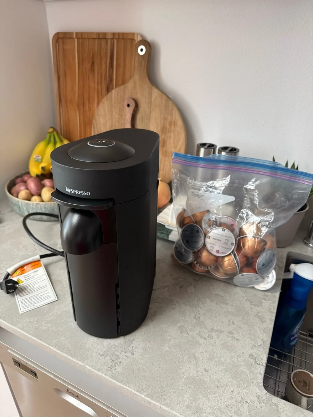 Nespresso VertuoPlus Coffee & Espresso Machine in Black with Gold Capsules